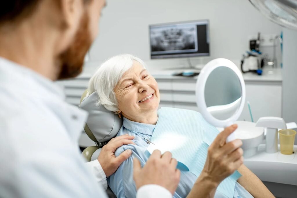 imgi 13 elderly woman enjoying her smile in the dental off 2023 11 27 05 21 30 utc 2880w (1)